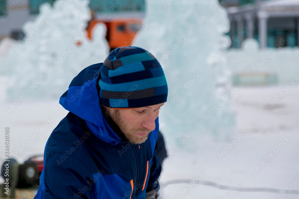 Portrait of an assembler in a blue jacket Portrait of an assembler in a blue jacket
