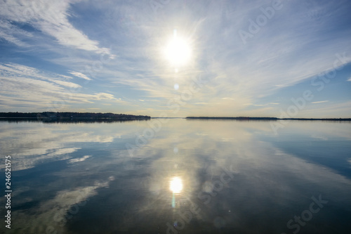 Still waters of Breton Bay create a mirror image of the  late afternoon sky.