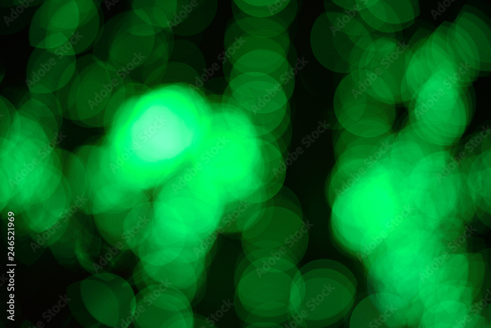 Obraz premium Abstract green bokeh on black background and lights at night picture