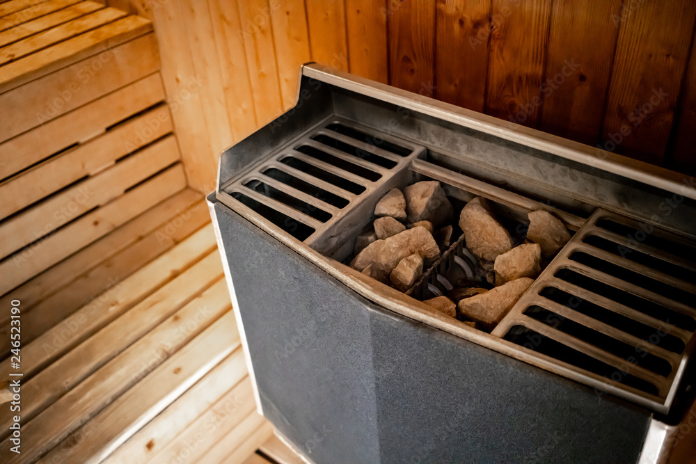Hot stone heater machine in sauna spa room.