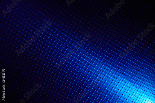 Diagonal bright beam of light on a blue background to the point