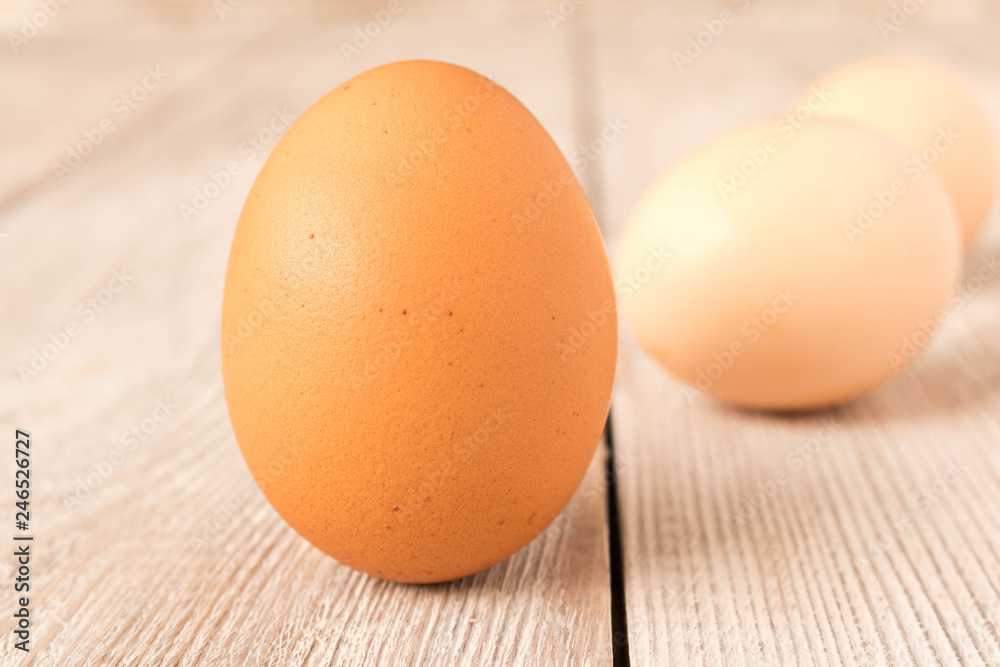 Chicken eggs on a wooden table. Selective focus. Chicken eggs on a wooden table. Selective focus.