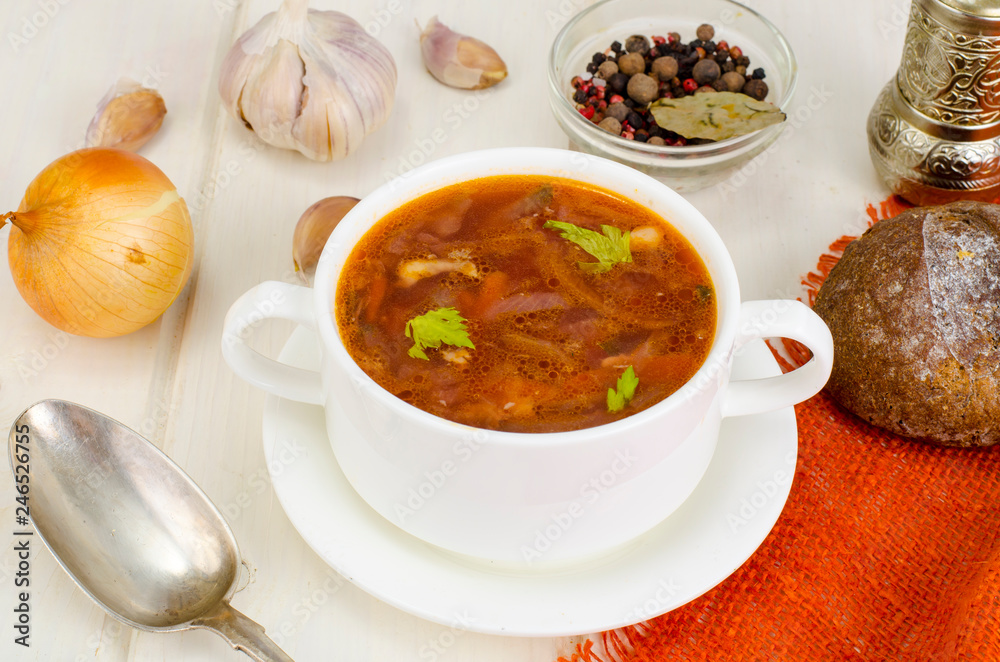 Soup with vegetables on white wooden surface Soup with vegetables on white wooden surface