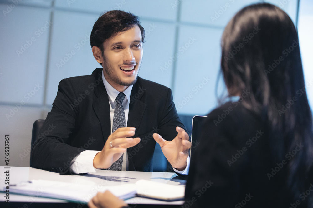 Businessmen and Businesswomen discussing documents for job interview concept Businessmen and Businesswomen discussing documents for job interview concept