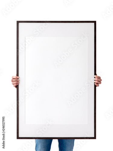 Holding frame mockup. Photo Mockup. The man hold frame. For frames and posters design. Frame size 24x36 (61x91cm).