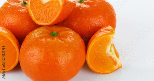 rotating fresh tangerines isolated on white background
