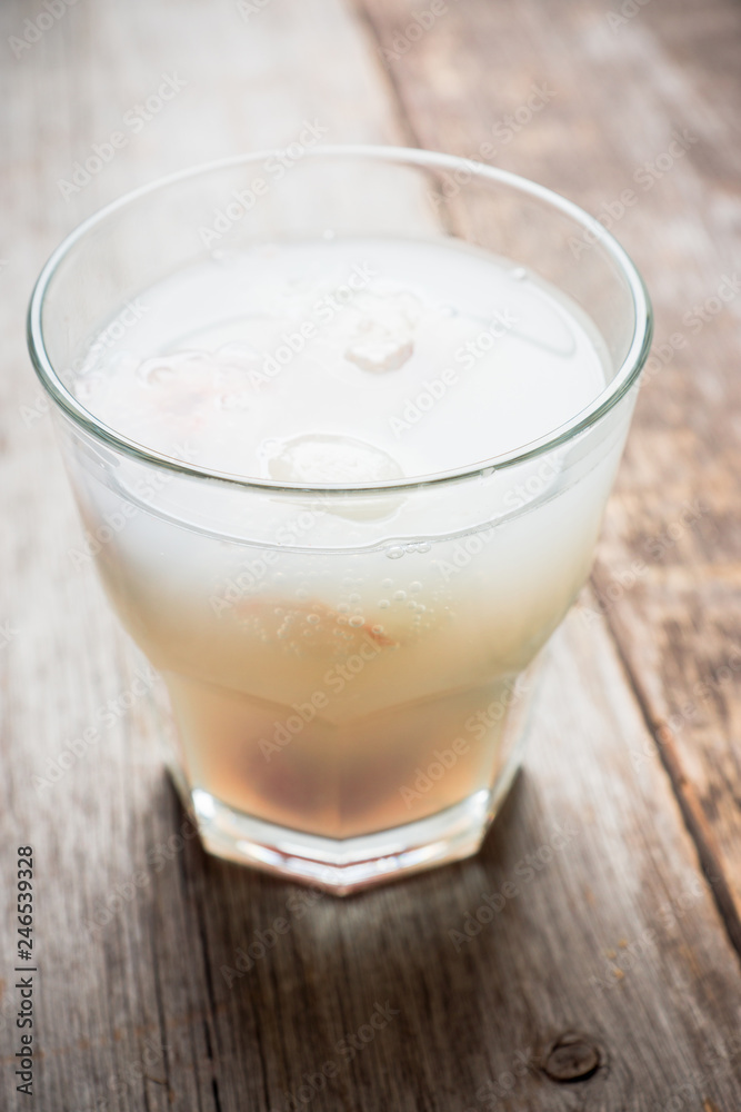 Old fahioned lychee cocktail on the rustic background. Selective focus. Shallow depth of field. Old fahioned lychee cocktail on the rustic background. Selective focus. Shallow depth of field.