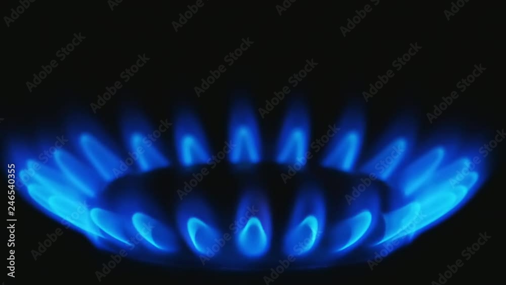 Close up view of the burning gas tongues of a kitchen gas stove. The initial phase of ignition. 4K UHD 2160p ultra high definition Close up view of the burning gas tongues of a kitchen gas stove. The initial phase of ignition. 4K UHD 2160p ultra high definition