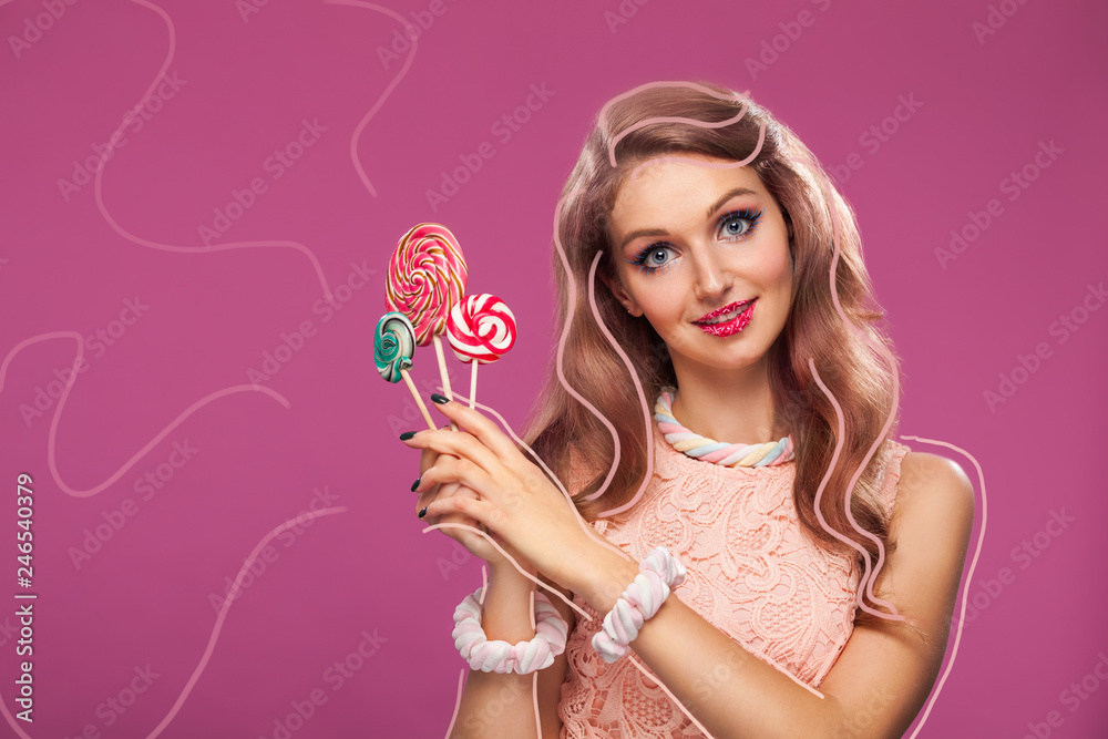 Beautiful pink lips with a sweet candy lollypop. Close up portret of young woman with candy in mouth. Beautiful pink lips with a sweet candy lollypop. Close up portret of young woman with candy in mouth.