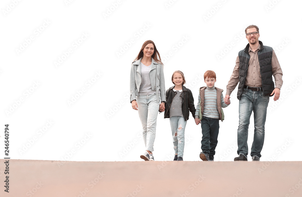 Fototapeta premium Happy family holding hands and walking