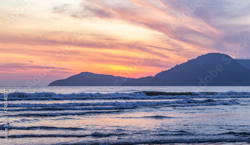 pink sunset over the sea with waves