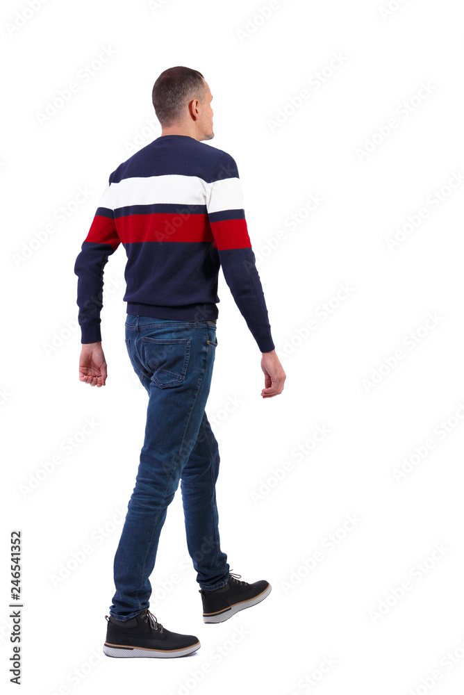 Back view of going handsome man in sweater. Back view of going handsome man in sweater.