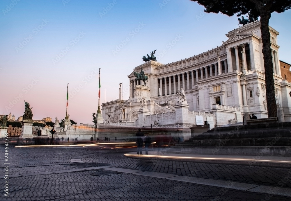Il Vittoriano in Rome at dusk with light trails