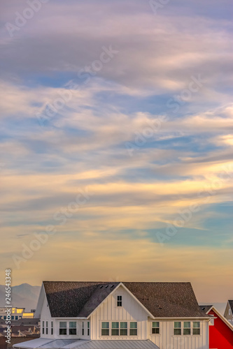 Blue sky with clouds over homes in Daybreak Utah
