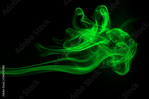 Green smoke abstract on black background, darkness concept