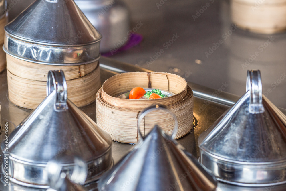 The background of food that is put in a wooden container (dim sum) containing vegetables, pork, flour Used to make, a menu that requires steaming stoves for good taste, delicious to eat 
