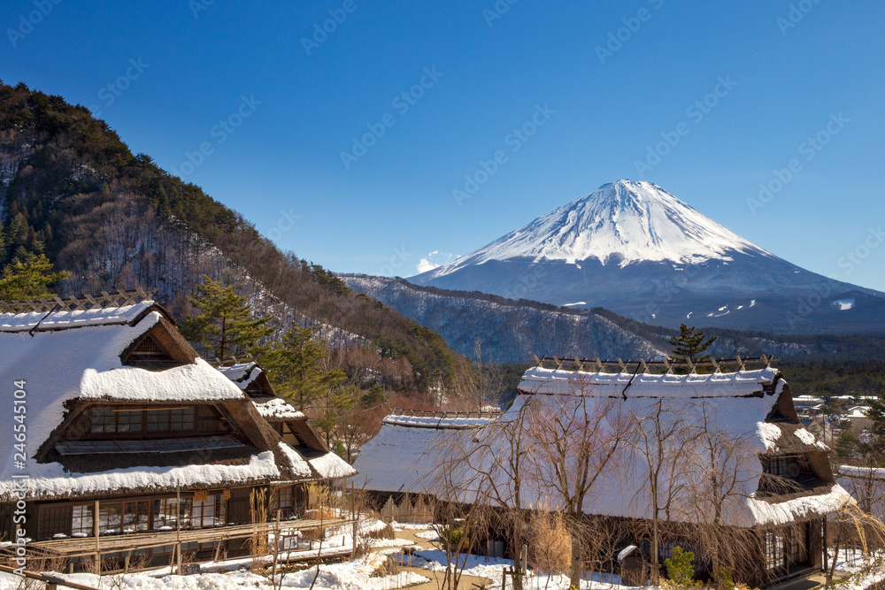 Mont Fuji on a clear winter day, from Saiko village covered by pristine snow in the five lakes region.
