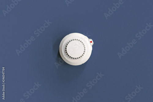 Smoke fire detected Smoke detector on dark blue. ceiling