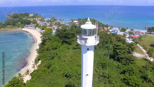 Aerial flying over lighthouse on tropical island in the Philippines photo