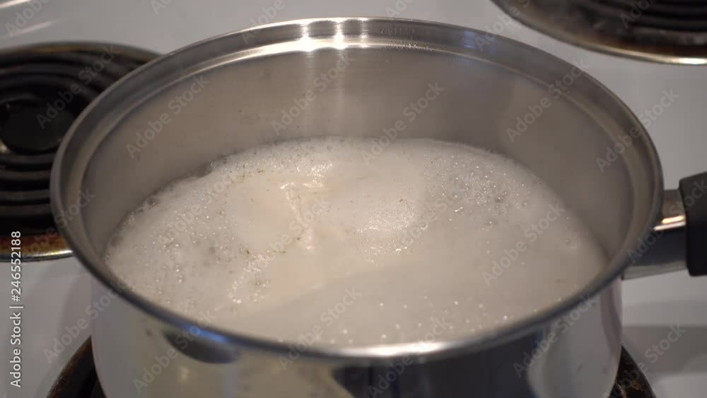 4K Pot Of Cooking Oatmeal Starting To Boil Over 4K Pot Of Cooking Oatmeal Starting To Boil Over