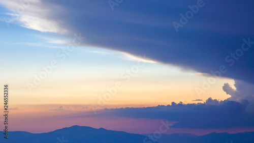 sunset in the clouds on a mountain background