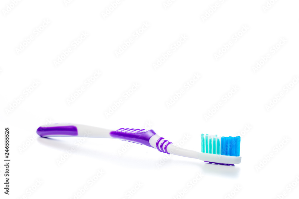 colored toothbrush on an isolated background, close up colored toothbrush on an isolated background, close up