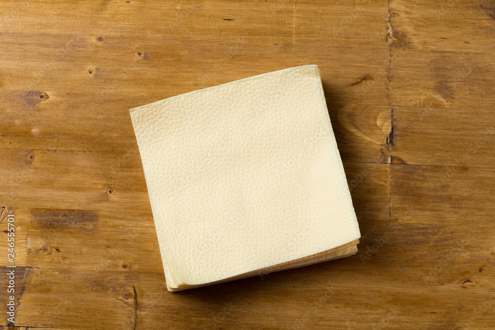 paper napkin on wooden background. paper napkin on wooden background.