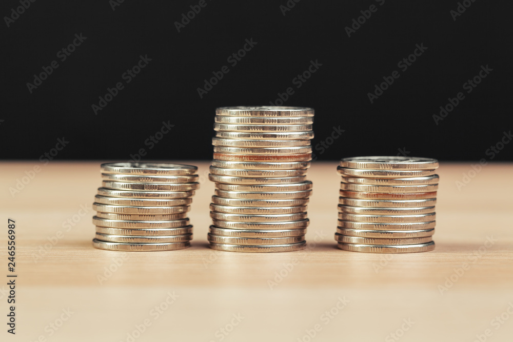 piles of coins on working table piles of coins on working table