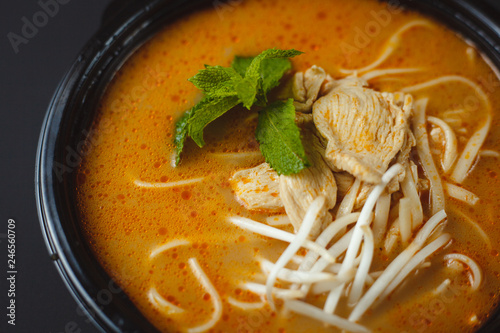 Vietnamese Fo-Bo soup with rice noodles and chicken photo