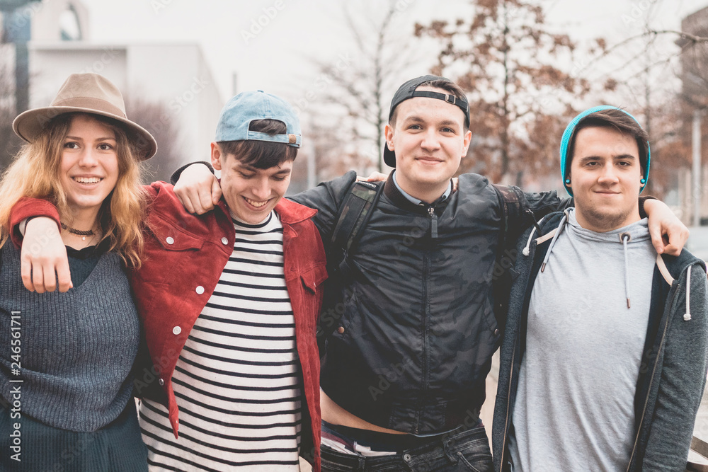 group of friends holding together outdoor in daylight
