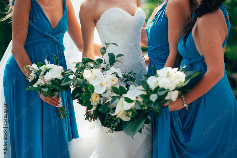 Wedding flowers in hand the bride and her bridesmaids. Wedding flowers in hand the bride and her bridesmaids.