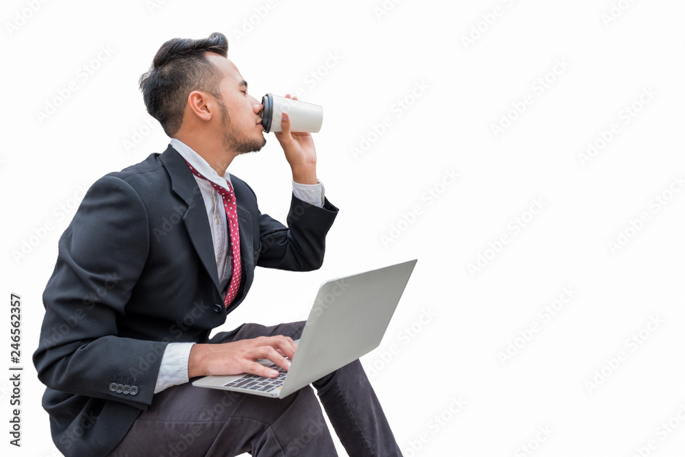 Handsome businessman sit drinking coffee with using laptop, isolated on background