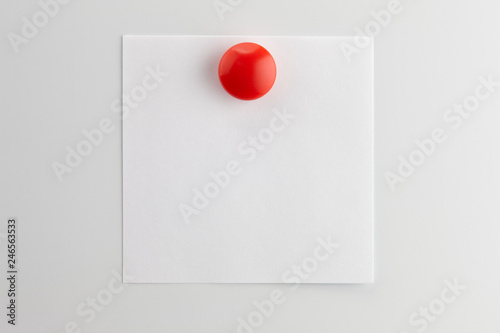 Square blank sheet of white paper pinned
