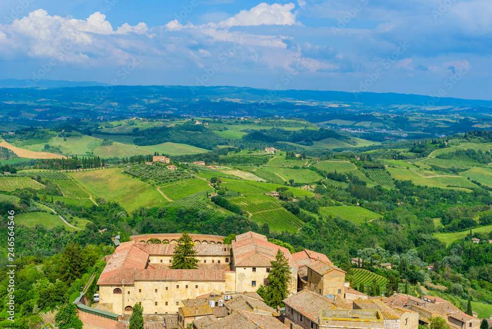 San Gimignano - Aerial view of the historic town with beautiful landscape scenery on a sunny summer day in Tuscany, small walled medieval hill town with towers in the province of Siena, Italy