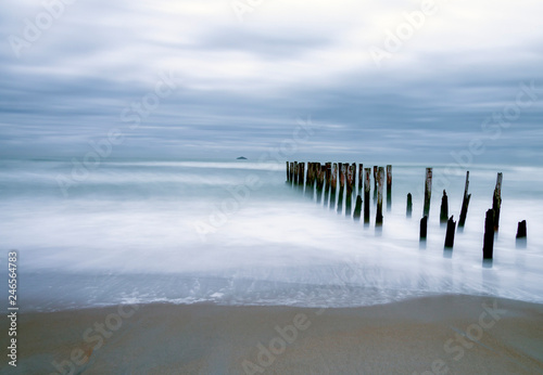 Calm blue overcast morning at the beach 