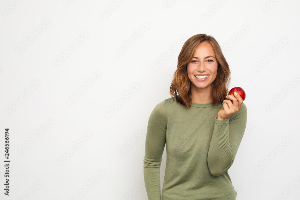 portrait of happy young woman with red apple portrait of happy young woman with red apple