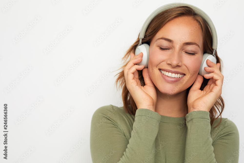 portrait of a young smiling woman with headphones portrait of a young smiling woman with headphones