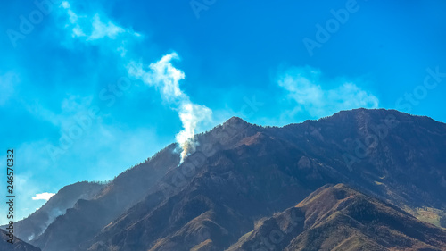 Fire in Bald Mountain Utah under vivid blue sky