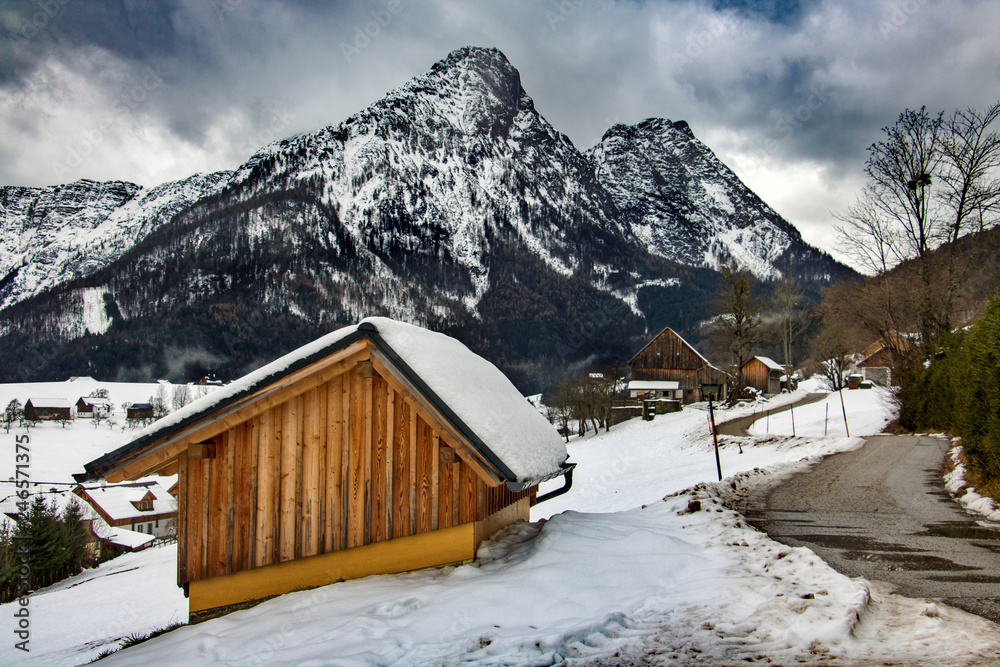 A wooden building in snowy mountains in Austria. Winter Alps.