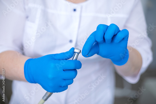 Dental drill in the hands of the dentist
