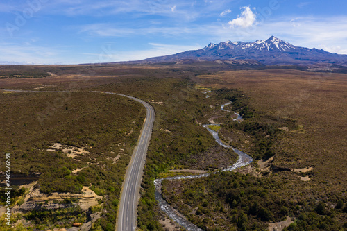Desert road through Tongariro national part, Mt Ruapehu in the distance  photo