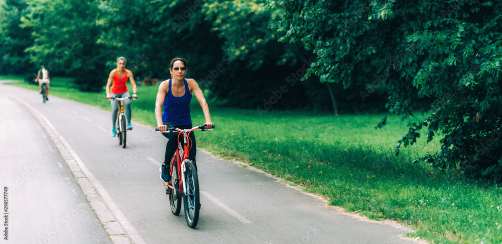 Women Riding Bicycles Together Women Riding Bicycles Together