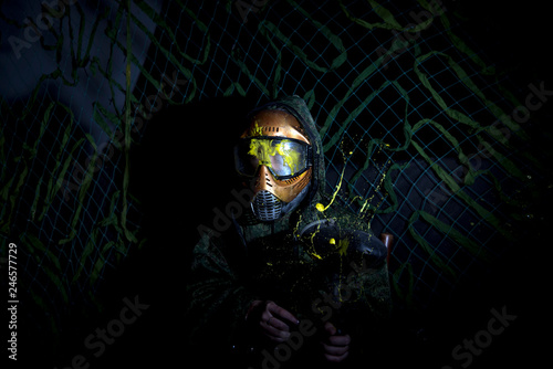 Paintball Mask zoomed in on.Splashes after direct hit to protecting mask in the paintball game.the photo as a paintball sphere is broken off at blow about a helmet.direct hit (paintball game)