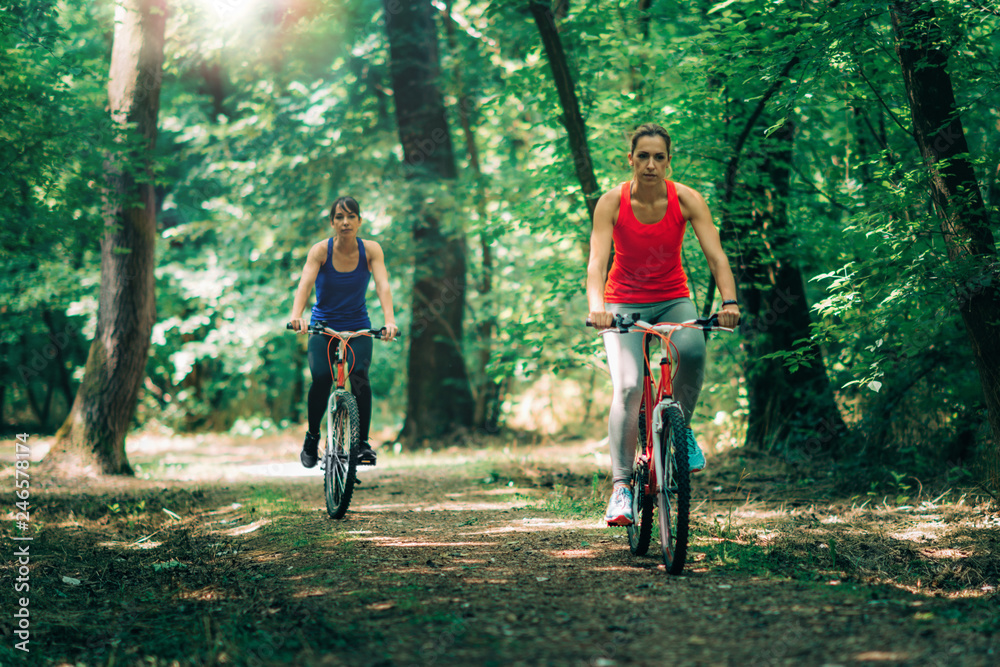 Naklejka premium Two Women Cycling Together