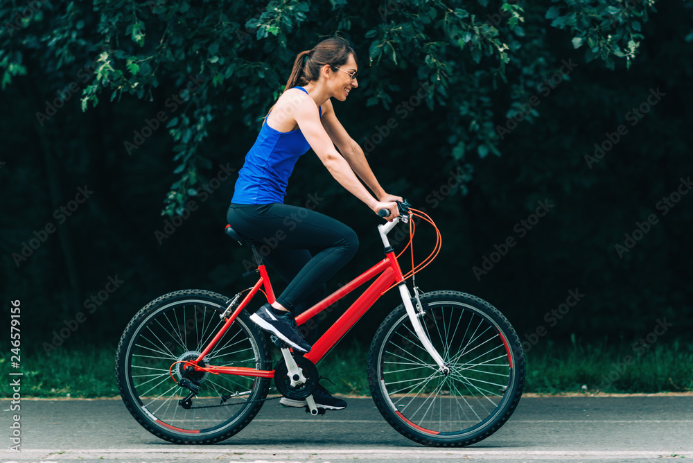 Woman Cycling in a Park