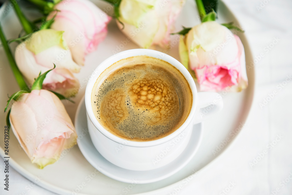 Morning coffee cup with roses bouquet in a tray in bed, top view, romantic bed breakfast or coffee Morning coffee cup with roses bouquet in a tray in bed, top view, romantic bed breakfast or coffee