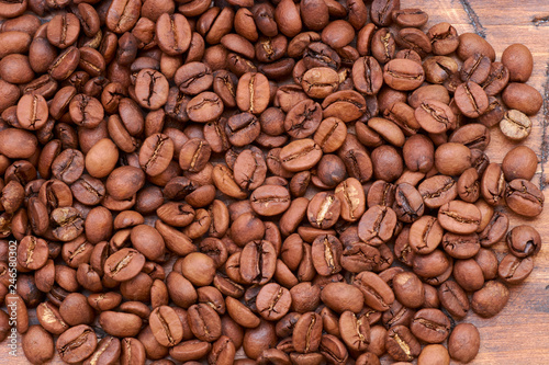 coffee beans on a wooden background scattered