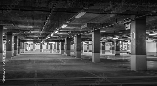 Empty car parking, new interiors spaces. Black and white photo