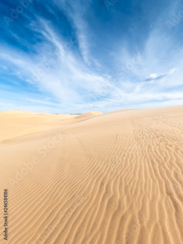 White sand dunes and blue sky background in Mui Ne   South of Vietnam