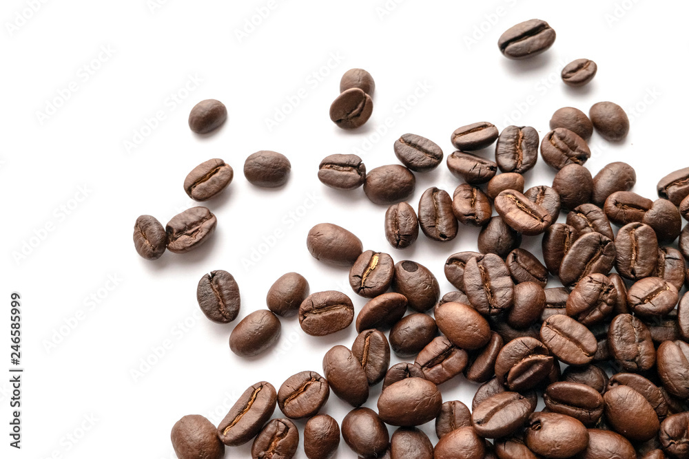 Roasted coffee beans isolated on white background. Close-up. Roasted coffee beans isolated on white background. Close-up.